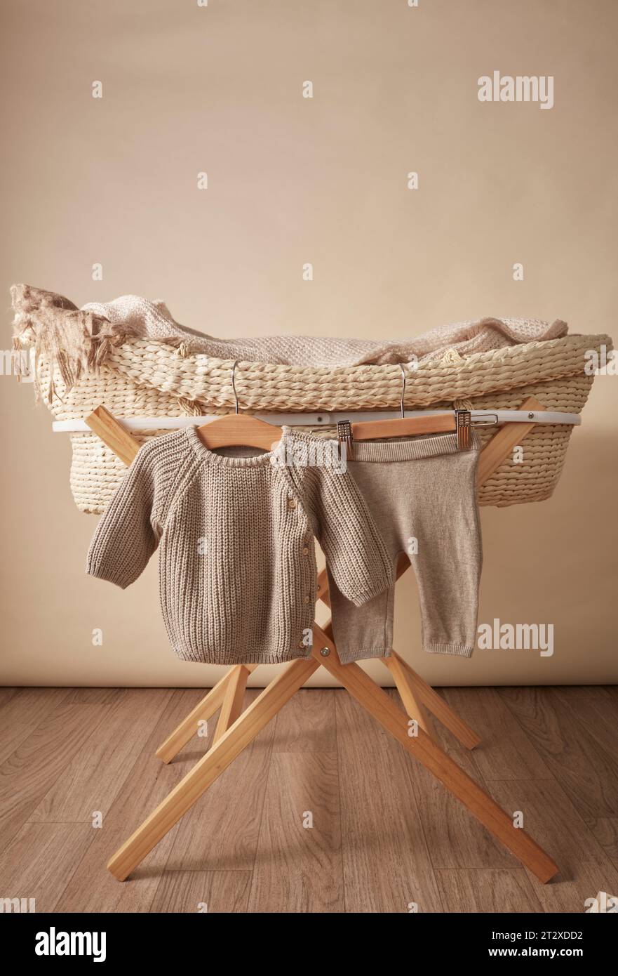newborn clothing with baby bassinet Moses basket Stock Photo - Alamy