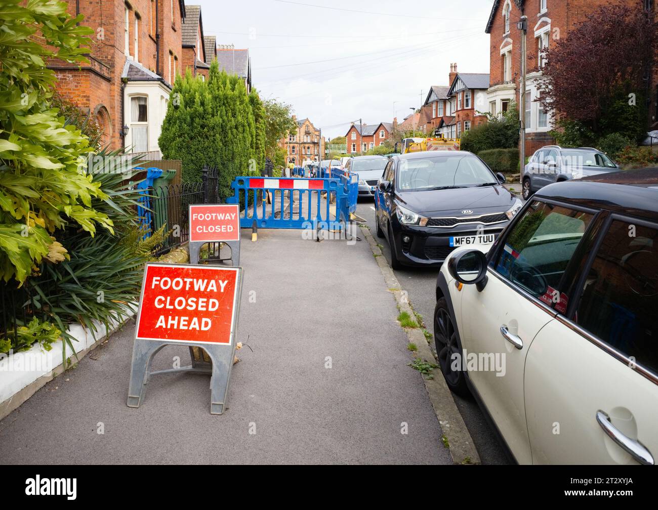 Disruption caused by fibre optic cables being laid in an urban street in Scarborough Stock Photo