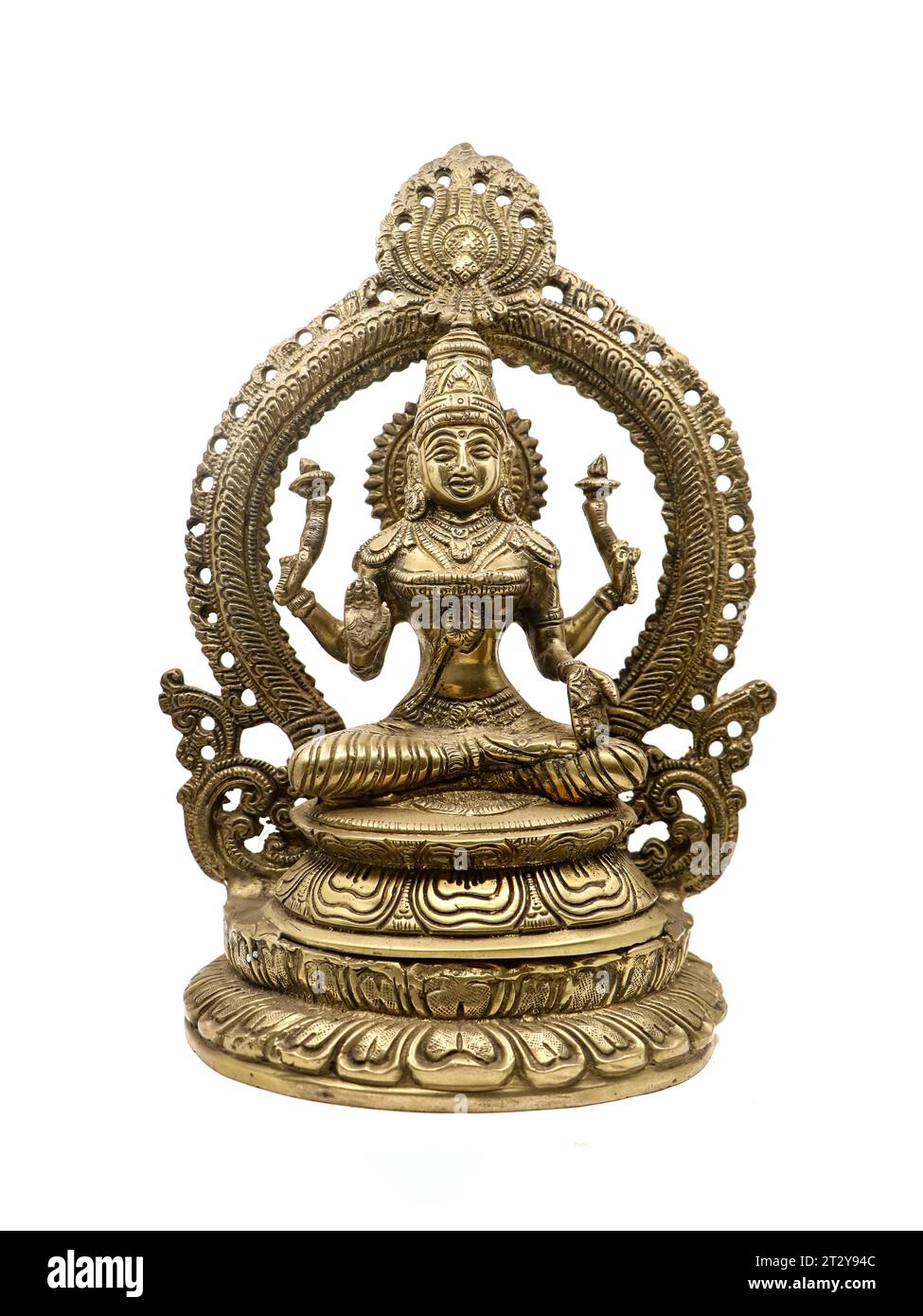 hindu goddess lakshmi with multiple hands blessing in a sitting position, antique brass statue front view isolated in a white background Stock Photo