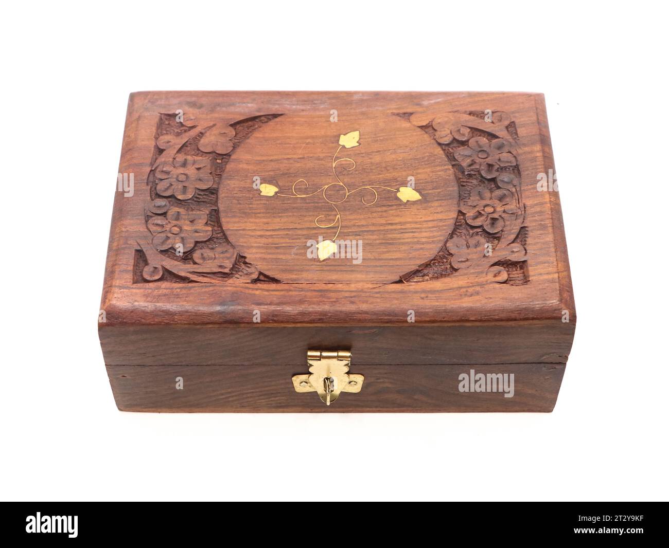 an antique jewellery box or treasure chest, decorated with wood carvings isolated in a white