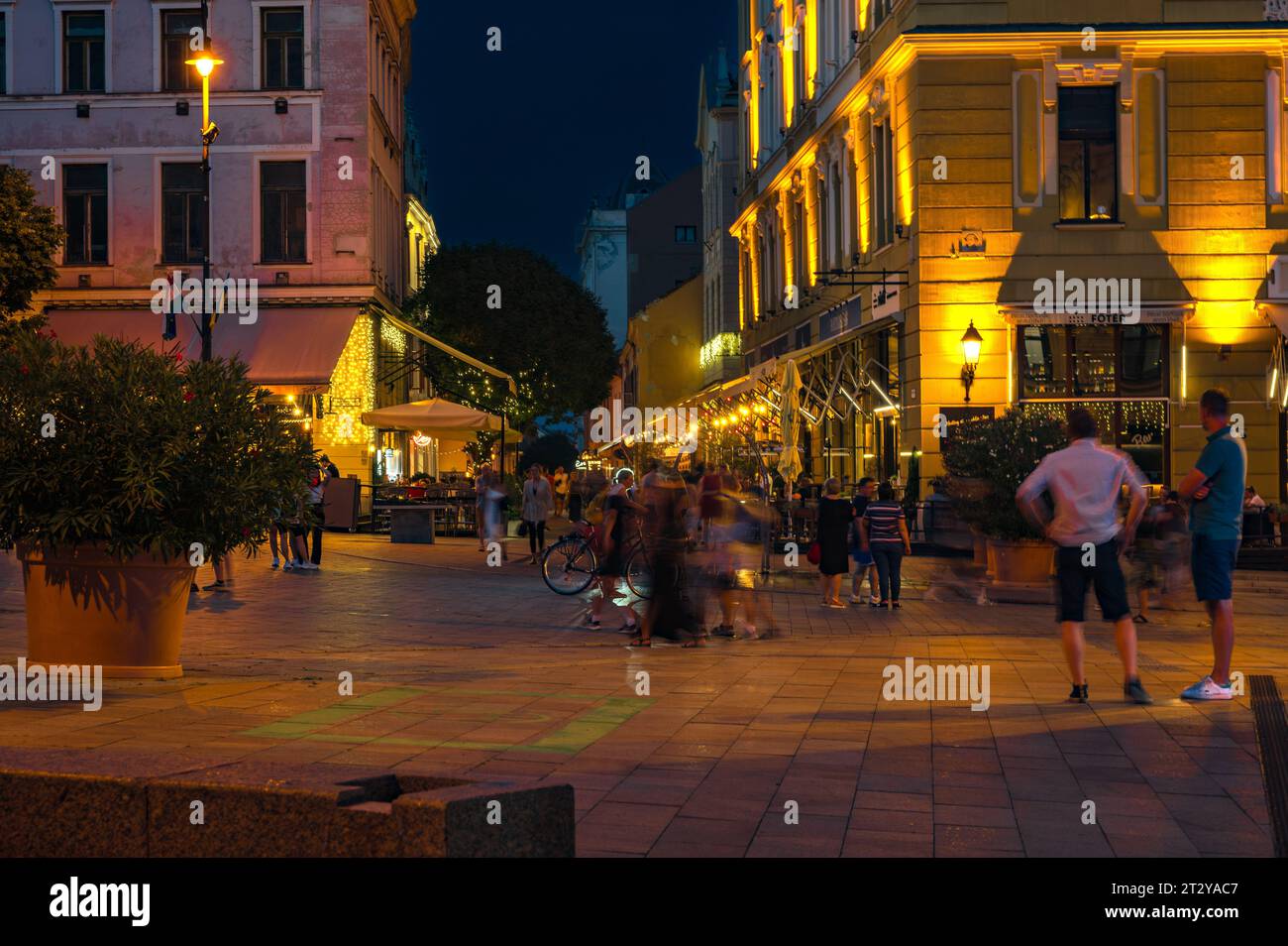 PECS, HUNGARY - 17 AUGUST 2022: Main square - Szechenyi - at evening in Pecs, view at Kiraly Street Stock Photo