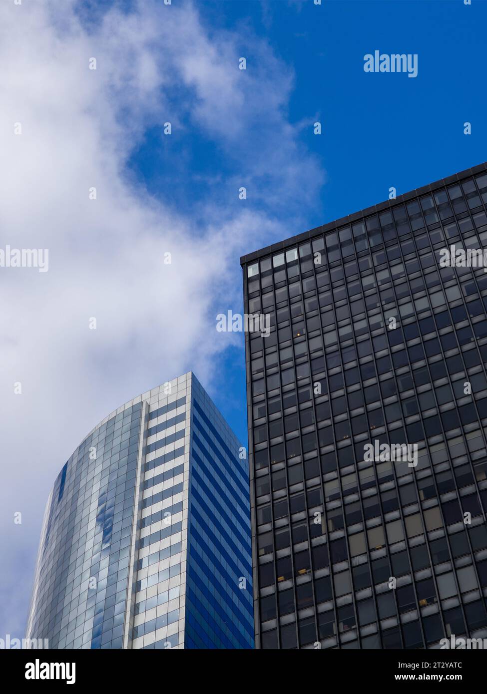 City Skyline featuring two tall buildings, with a vivid blue sky and ...