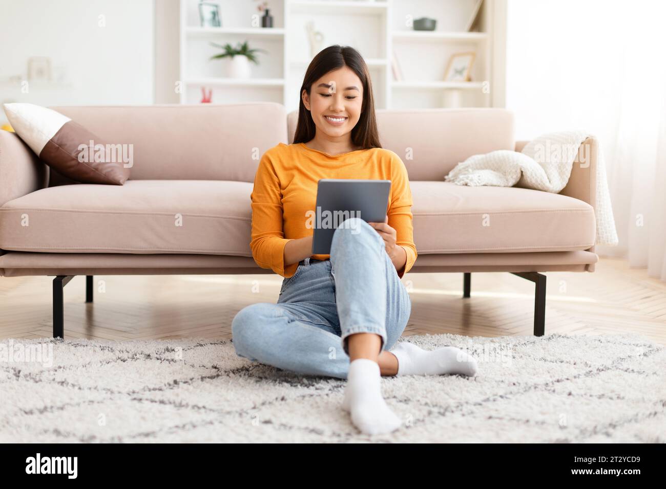 Happy taiwanese woman sitting in hi-res stock photography and images ...