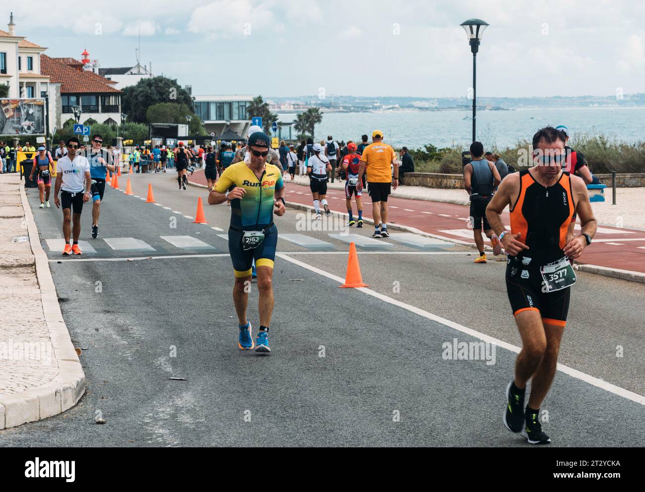 Cascais, Portugal - October 21, 2023: Ironmen competitors during the run stage in the Ironman 70.3 in Cascais, Portugal Stock Photo