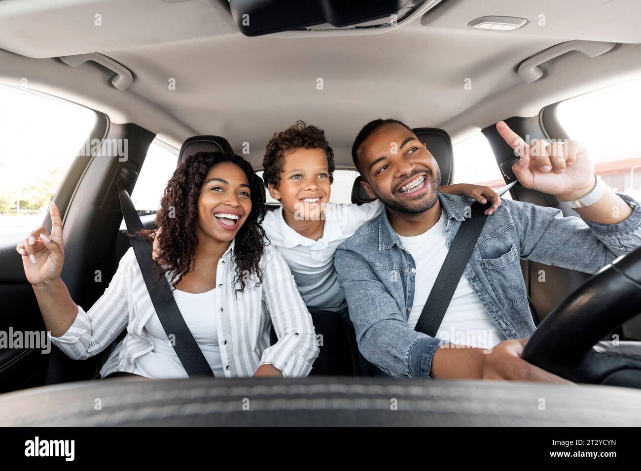 3rd Car Riding Happy Black Family Of Three Riding Car And Singing Songs Stock Photo ...