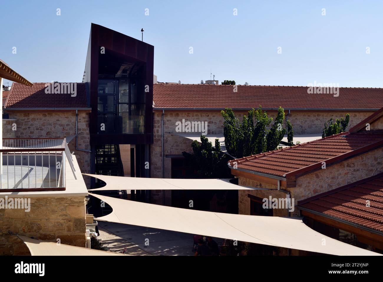 Paphos, Cyprus - September 27, 2023: Sun protection and modern architecture in the middle of the old walls in the old town, city was  European Capital Stock Photo