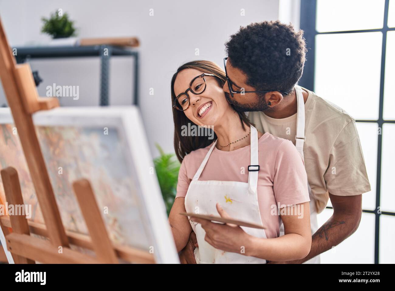 Man and woman couple smiling confident drawing at art studio Stock ...