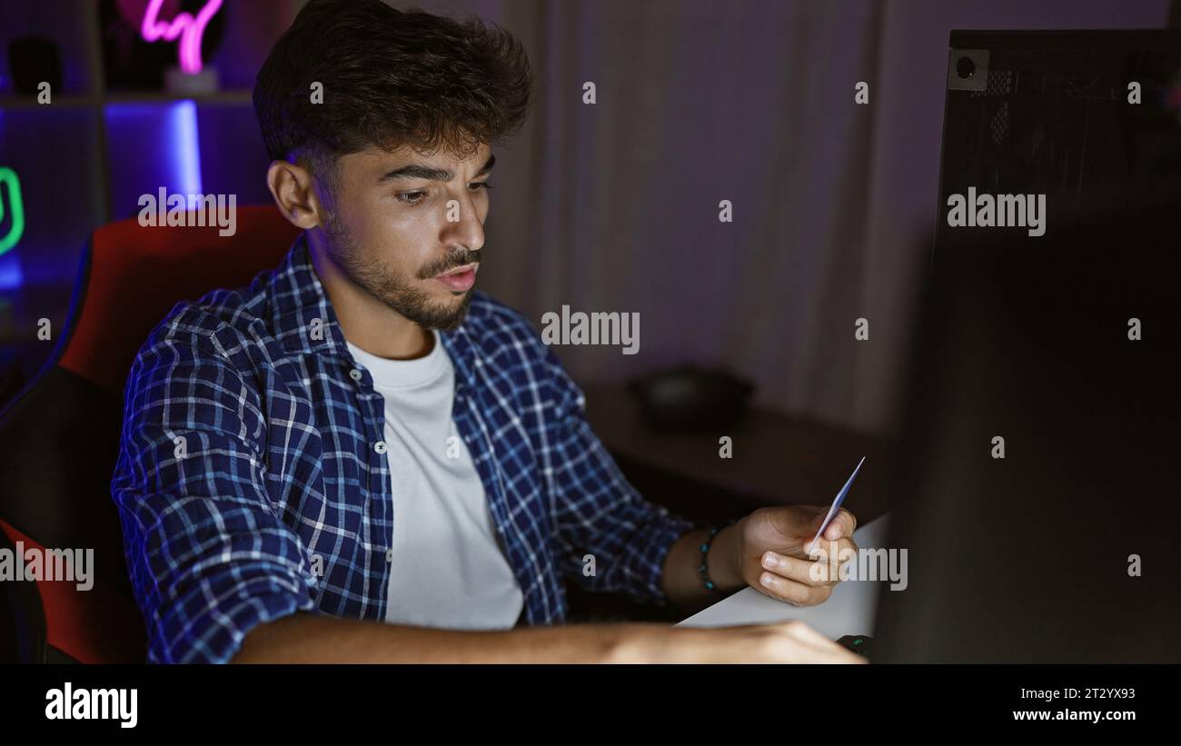 Thrilling night stream, young arab man engages in virtual gaming, using ...