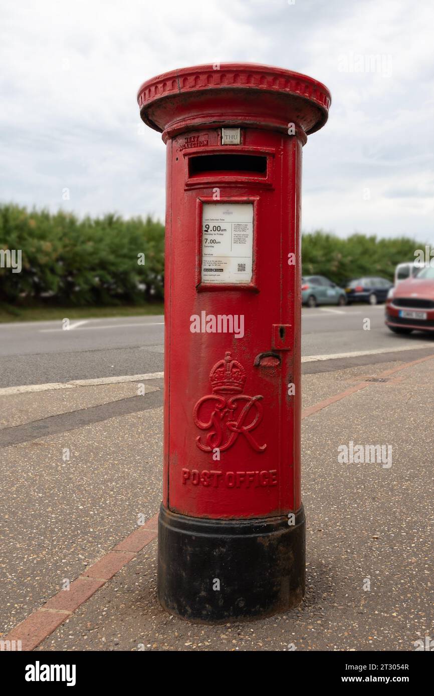 Red post box (G VI R) on the street in Worthing, West Sussex Stock Photo