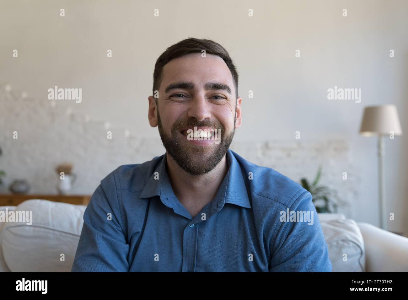 Cheerful handsome adult man home head shot portrait Stock Photo