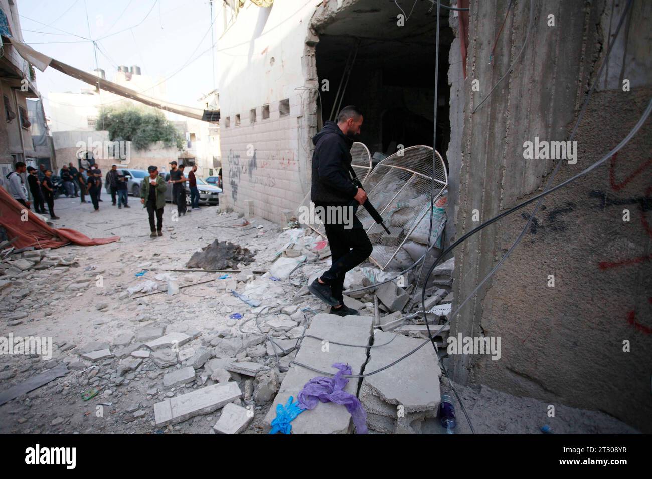Jenin Checkpoint People check the damage inside a building in the occupied West Bank ...
