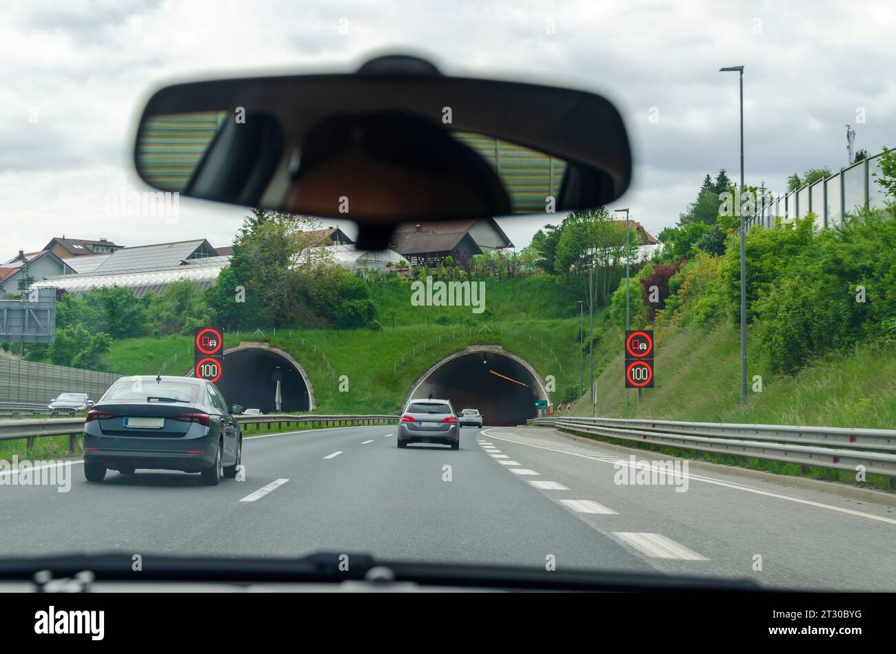 In front of tunnels on a highway - view from a car windshield Stock ...