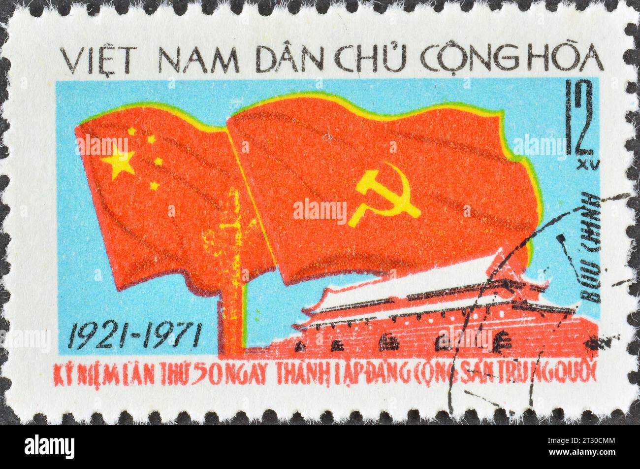Cancelled postage stamp printed by Vietnam, that shows Flags of China and USSR, 50th Anniversary of the Chinese Communist Party, circa 1971. Stock Photo