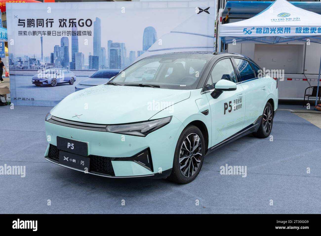 ZHONGSHAN GUANGDONG China-June 10 2022:a light green Xiaopeng P5 electrical car. Stock Photo
