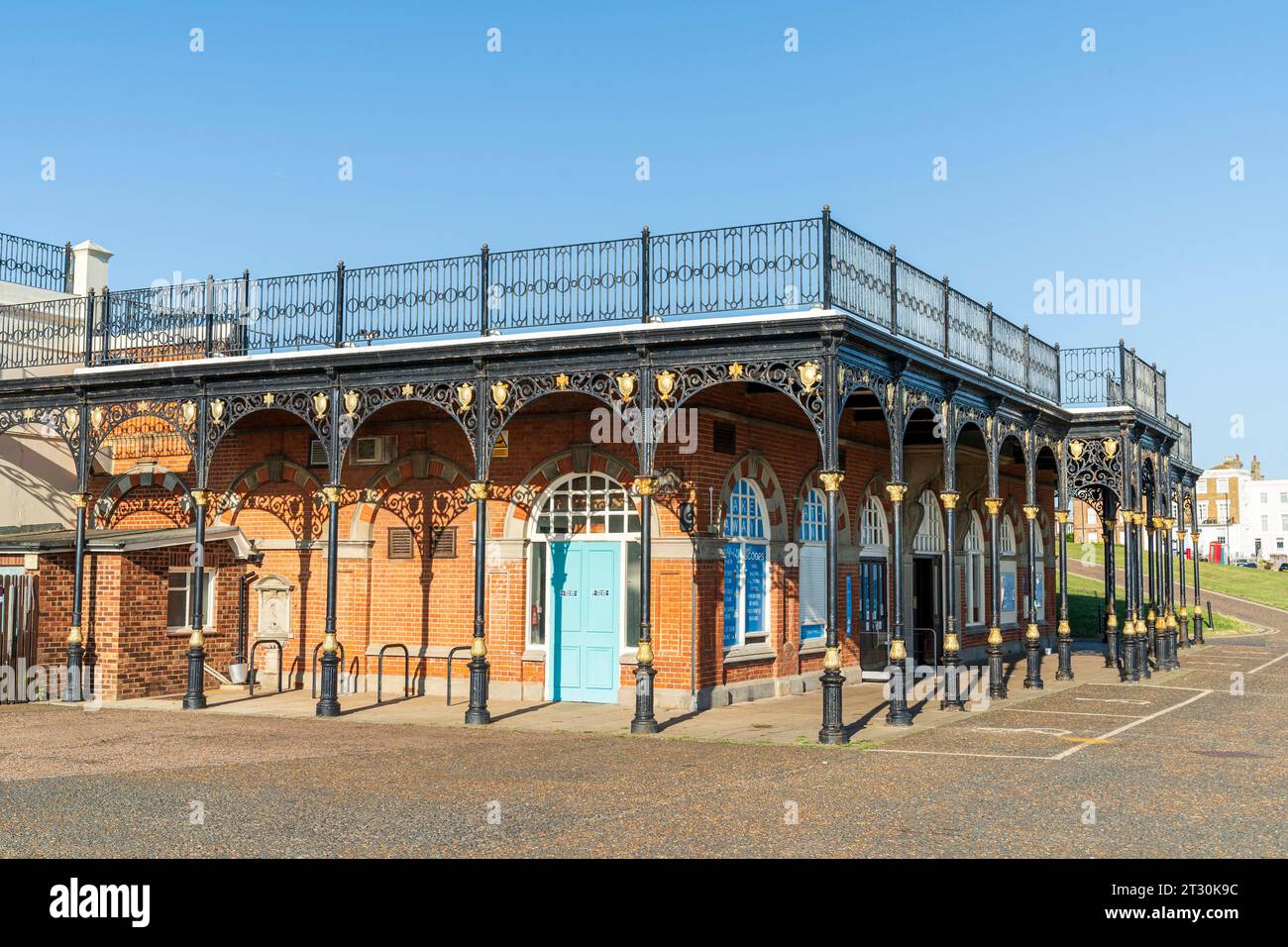 The King's Hall, Edwardian period concert building with ornate metal columns around the outside and rooftop balustrade. Herne Bay seafront. Blue sky. Stock Photo