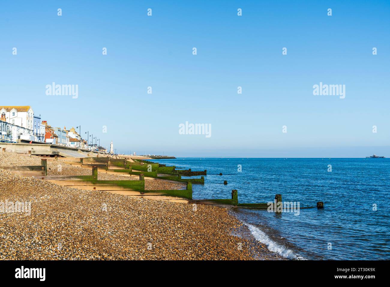View Along Empty Shingle Beach And Breakwaters At Herne Bay The Clock view-along-empty-shingle-beach-and-breakwaters-at-herne-bay-the-clock