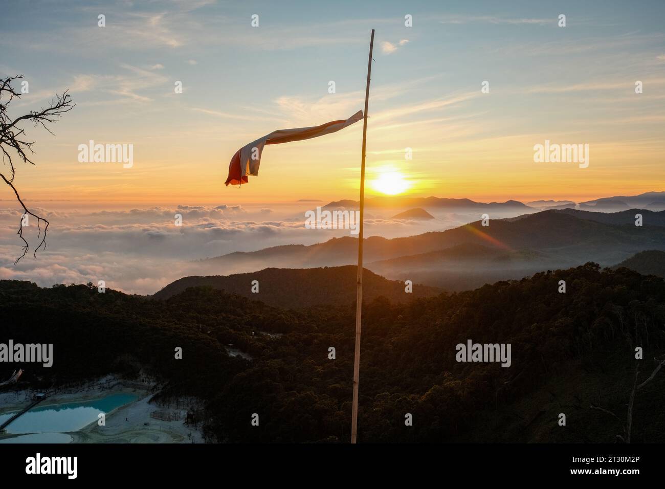 Amidst the mystical ambiance of Kawah Putih, the Indonesian flag