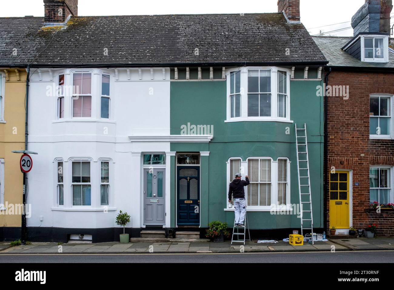 A Painter and Decorator Working In The Town of Lewes, East Sussex, UK. Stock Photo