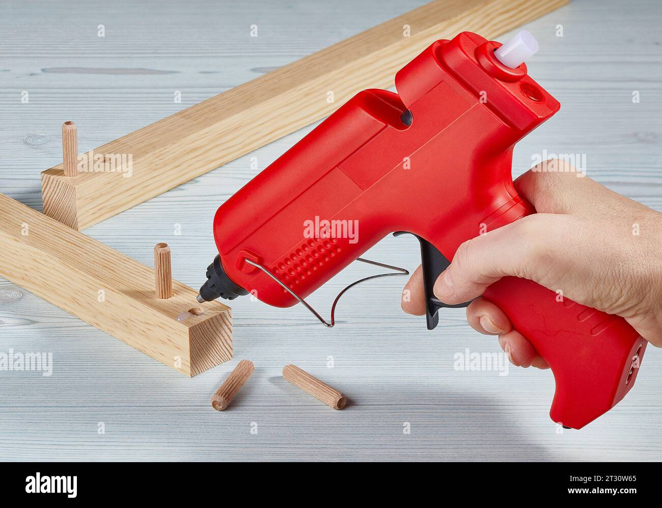 working with red hot glue gun Stock Photo Alamy