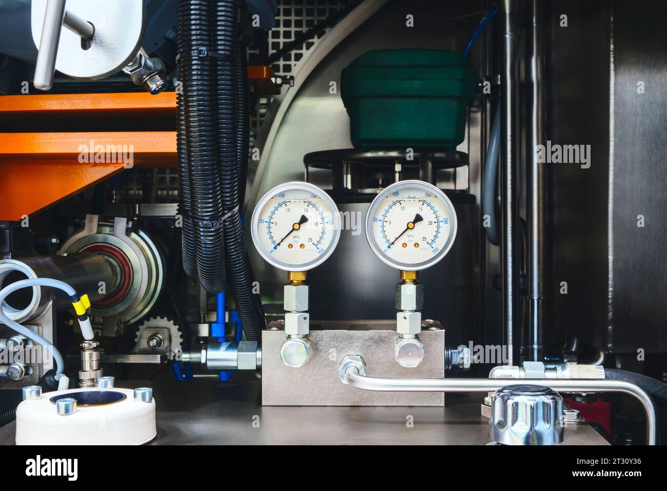 air conditioner technician using manifold gauge checking refrigerant