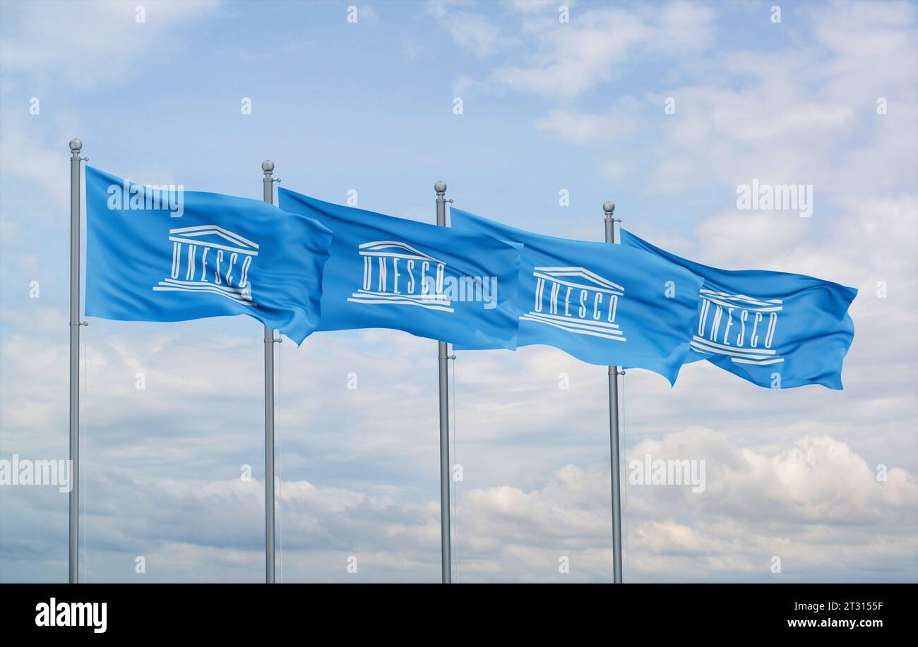 UNESCO four flags in row waving together on blue cloudy sky ...