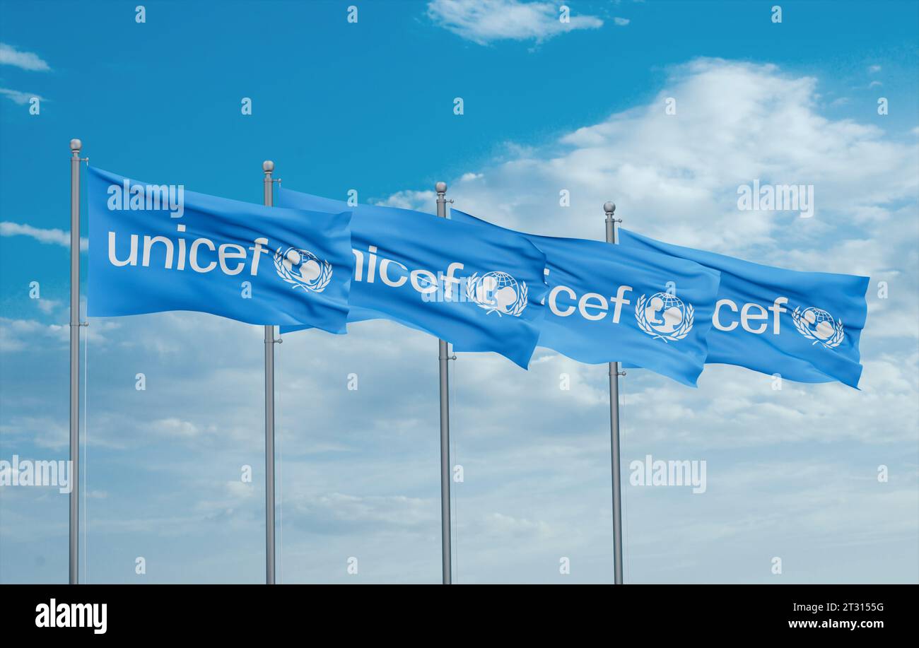 UNICEF four flags in row waving together on blue cloudy sky ...