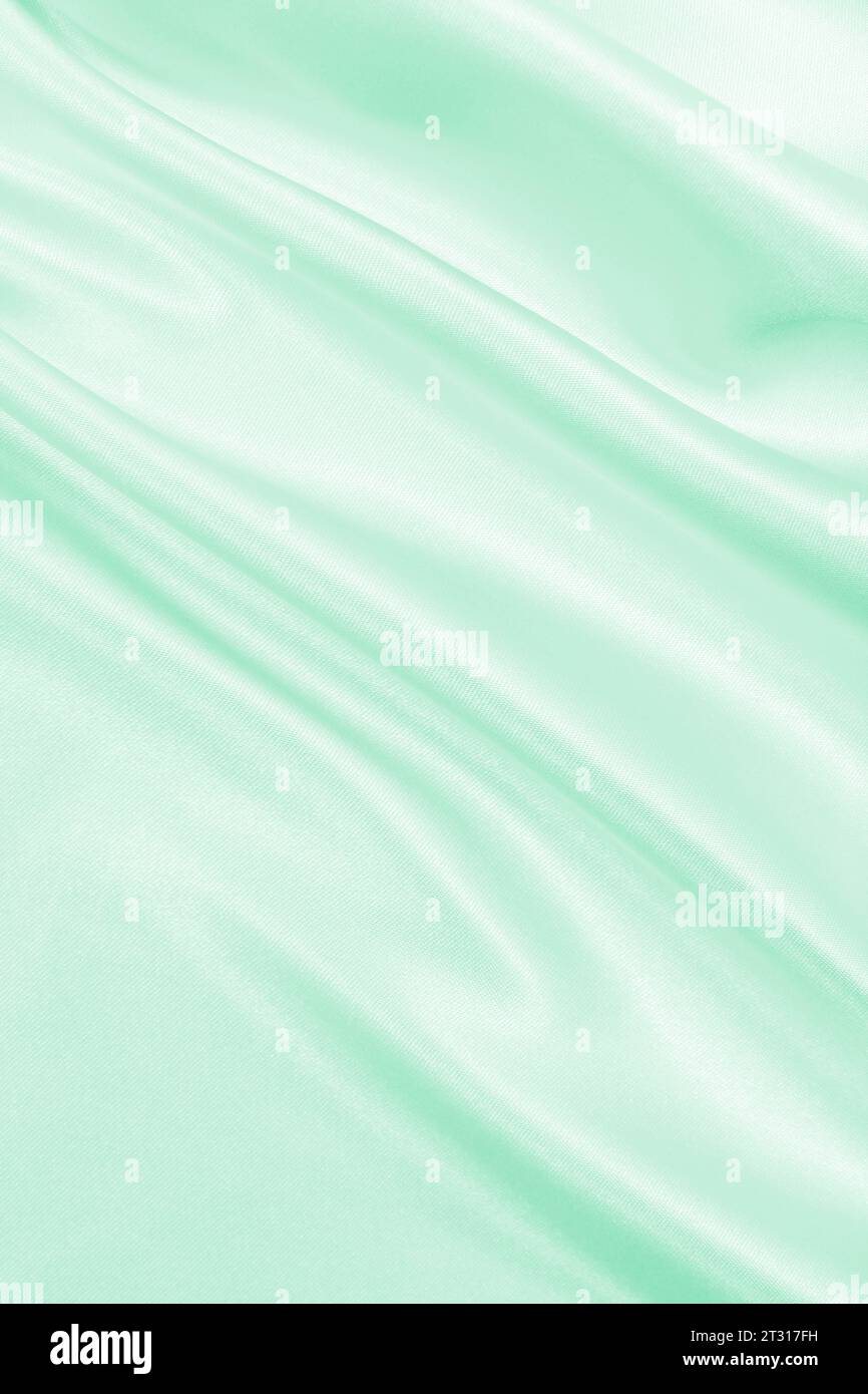 Smooth elegant green silk or satin luxury cloth texture can use as ...