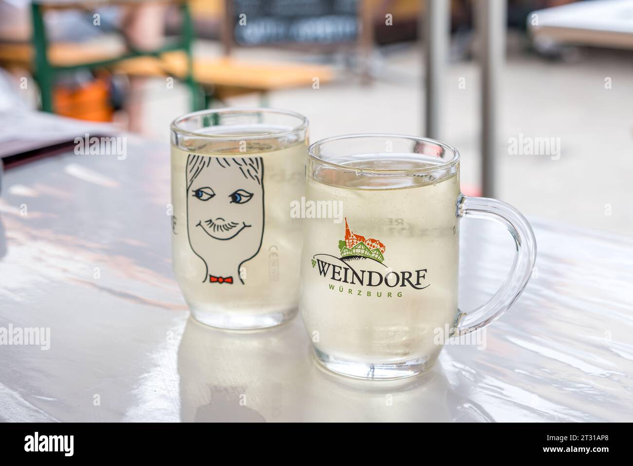 View of two glasses of white wine at the Weindorf wine festival in the German city Würzburg. Stock Photo
