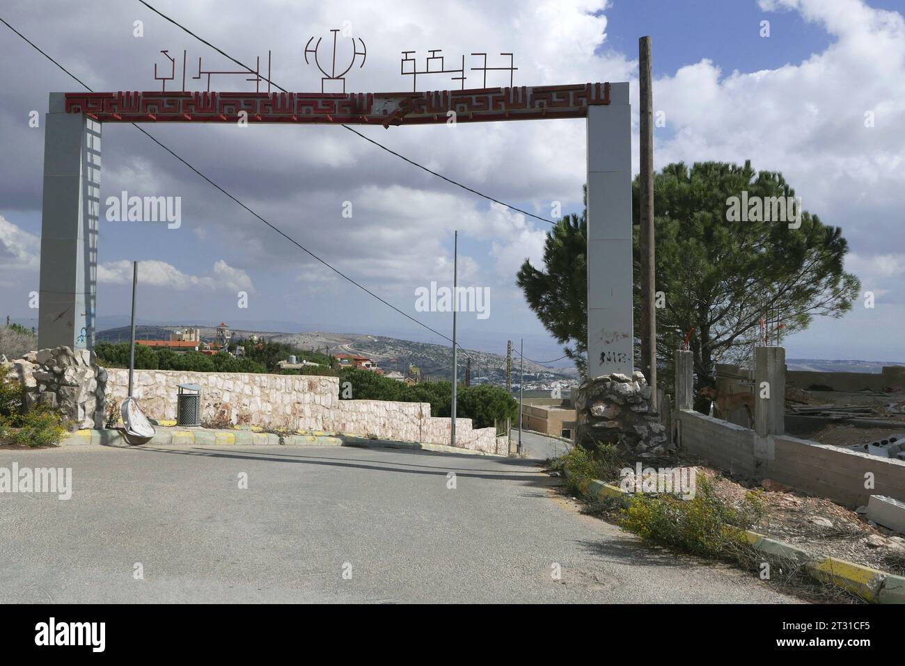 The entrance of Iran Garden, Maroun al Ras, Lebanon, October 20 2023. Maroun Al Ras, a Hezbollah stronghold atop a hill one kilometer from the border, was the scene of many fights on last days. Reportedly, 5 Hezbollah fighters have been killed by by an Israeli airstrike on October 17; the night after, the statue of Iranian military officer Qasem Soleimani was targeted and destroyed by IDF in the park known as 'Iran Garden', a symbol of Iranian influence in the region. The actual border between the two countries is the white wall in the middle of the pic, called by UN 'the blue line'. (Photo Stock Photo