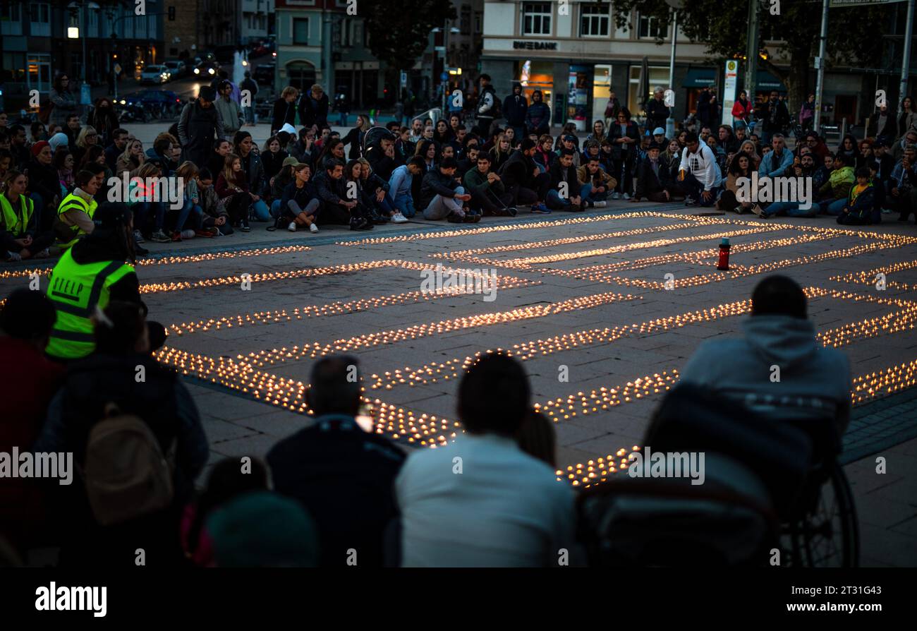 Stuttgart, Germany. 22nd Oct, 2023. Several thousand candles burn at a silent vigil organized by the aid organization STELP on Marienplatz in Stuttgart. The tea lights are meant to set a sign for all civilian victims of the Middle East conflict. Credit: Christoph Schmidt/dpa/Alamy Live News Stock Photo