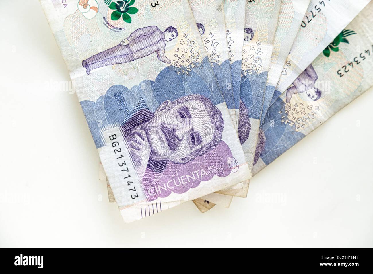 Banknotes of 50 thousand Colombian pesos in fan shape on a white ...