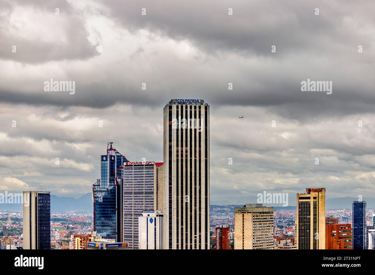 Bogota, Colombia January 23, 2023 Plane flies over the skyscrapers