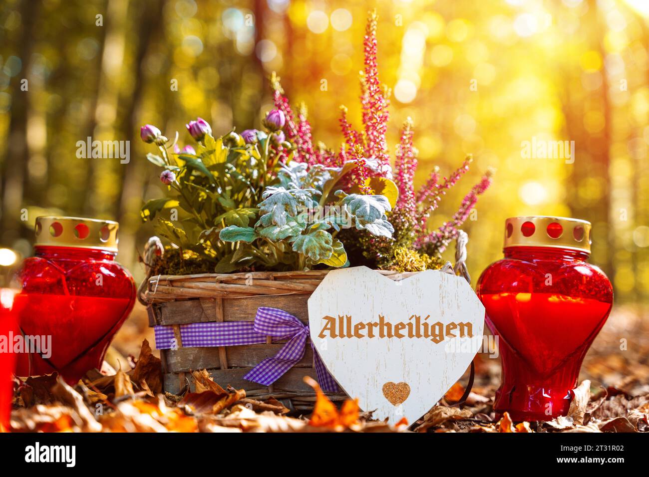 22 October 2023: Grave candles with a flower arrangement and greeting to All Saints Day holiday on 01 November PHOTOMONTAGE *** Grabkerzen mit einem Gesteck und Gruß zu Allerheiligen Feiertag am 01 November FOTOMONTAGE Credit: Imago/Alamy Live News Stock Photo