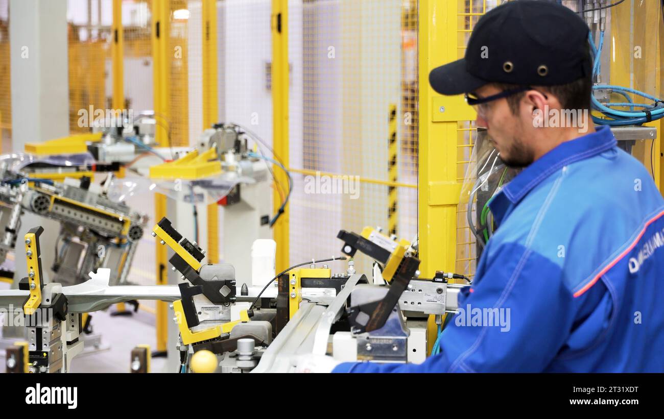 Berlin - Germany, december 6, 2022: Worker at a modern factory. Scene ...