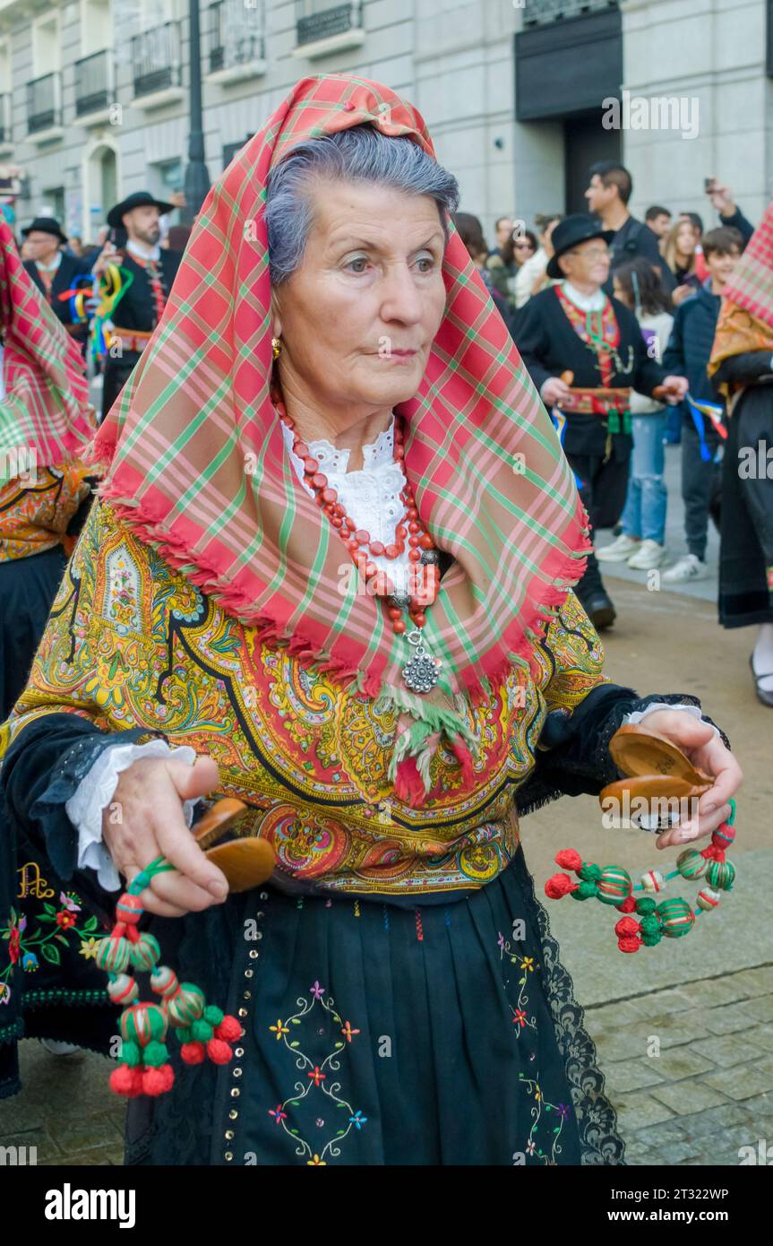 A woman in traditional country costume playing during the