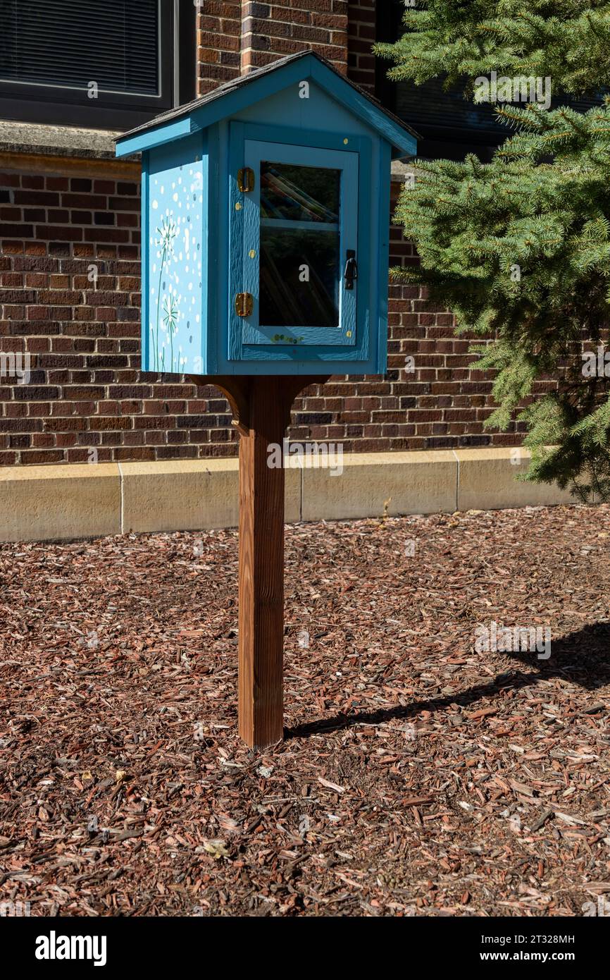 Sunny close up view of an cute little neighborhood free library book box Stock Photo