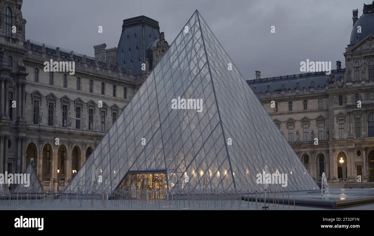 Beautiful pyramids of Louvre. Action. Beautiful square with glass ...