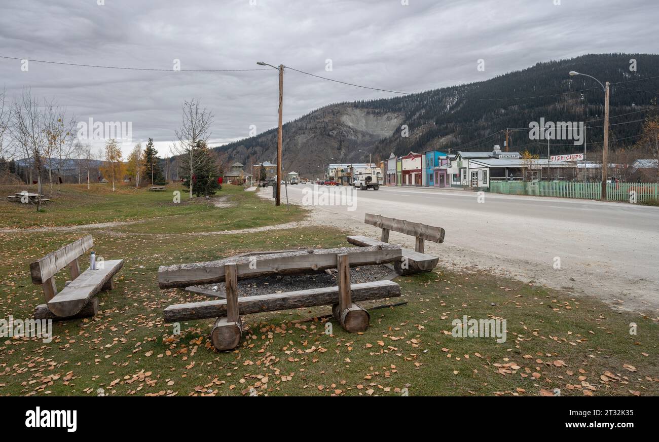 Log benches in a park at Dawson City, Yukon, Canada Stock Photo
