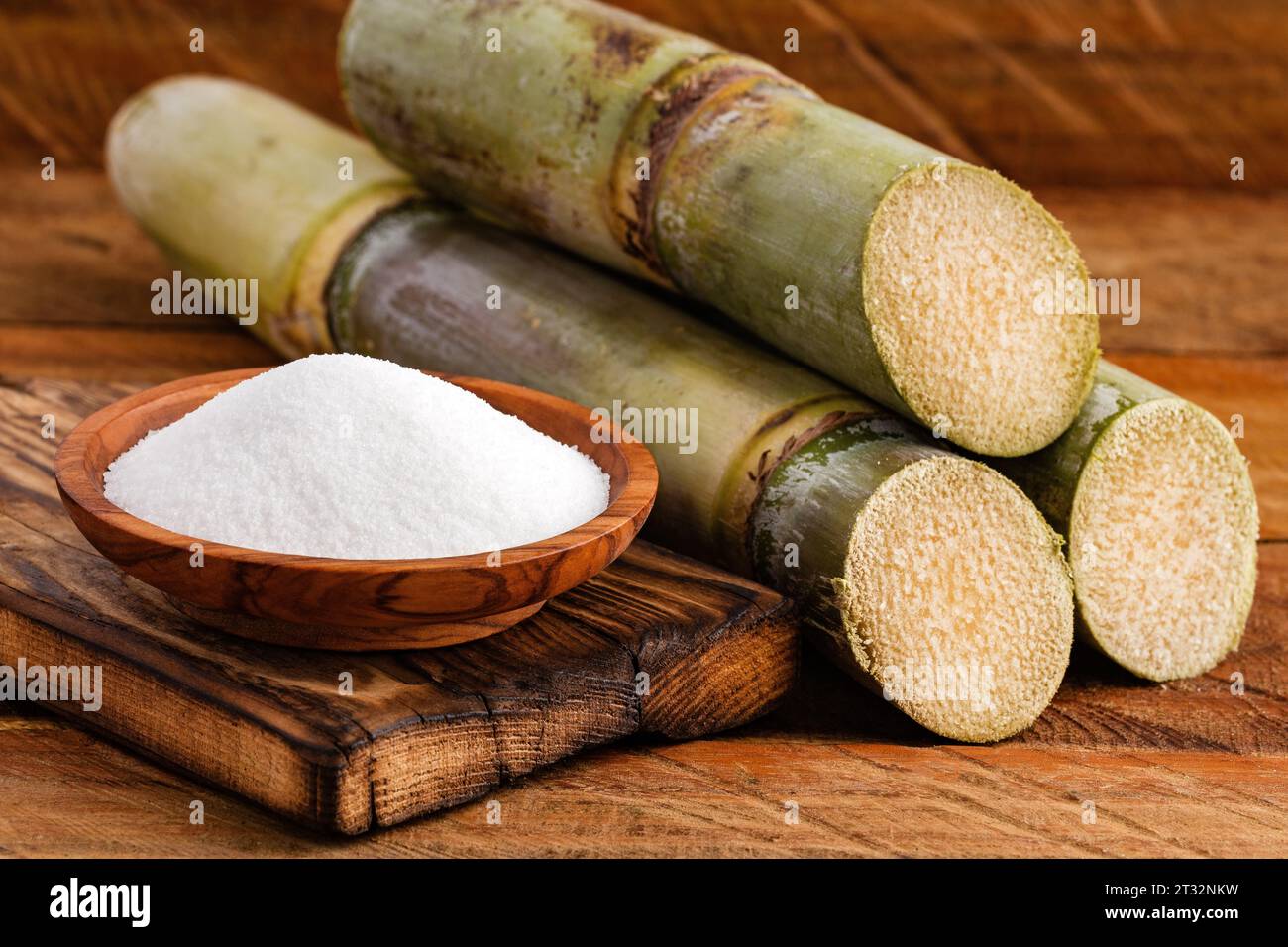 White sugar refined from the stalks of sugar cane Saccharum