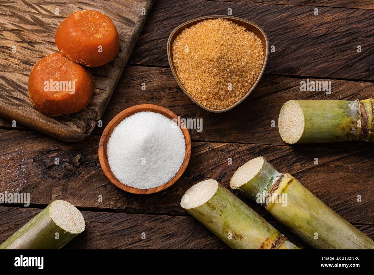 Saccharum officinarum - Panela, brown and white sugar with the stems of sugar cane Stock Photo