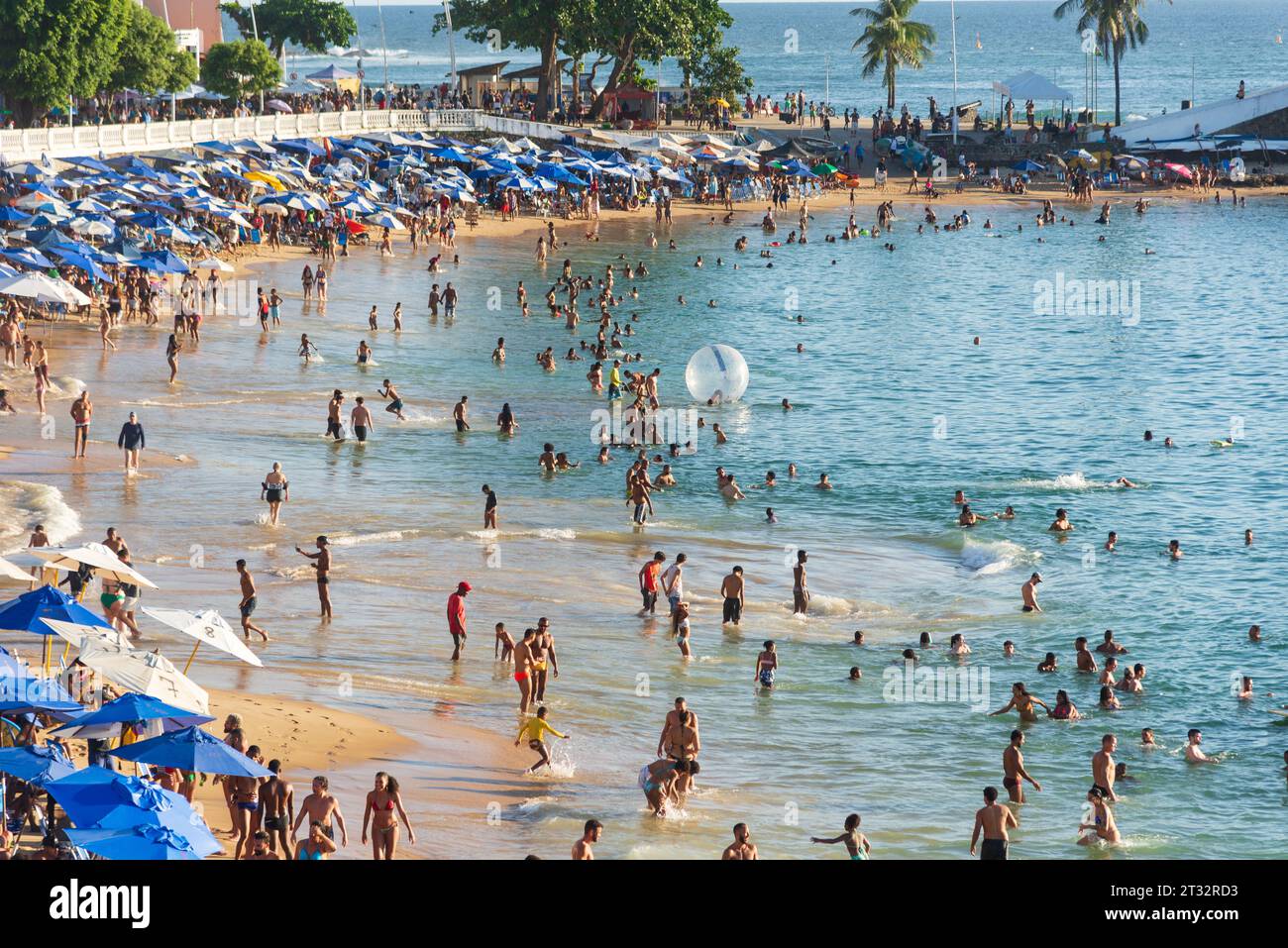 Salvador, Bahia, Brazil - October 21, 2023: View of Porto da Barra full of people bathing in the sun and sea in the city of Salvador, Bahia. Stock Photo