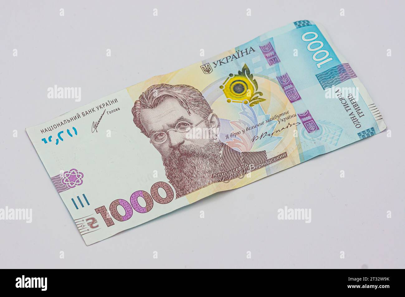 Ukrainian money bill one thousand hryvnia. The largest denomination. Used and a little crumpled. Isolated on a white background. Front side. new 1000 Stock Photo