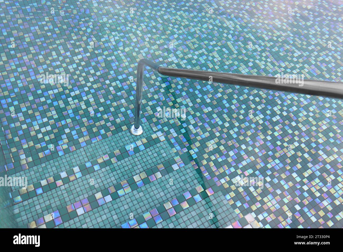 Metal rail and steps in outdoor swimming pool Stock Photo - Alamy