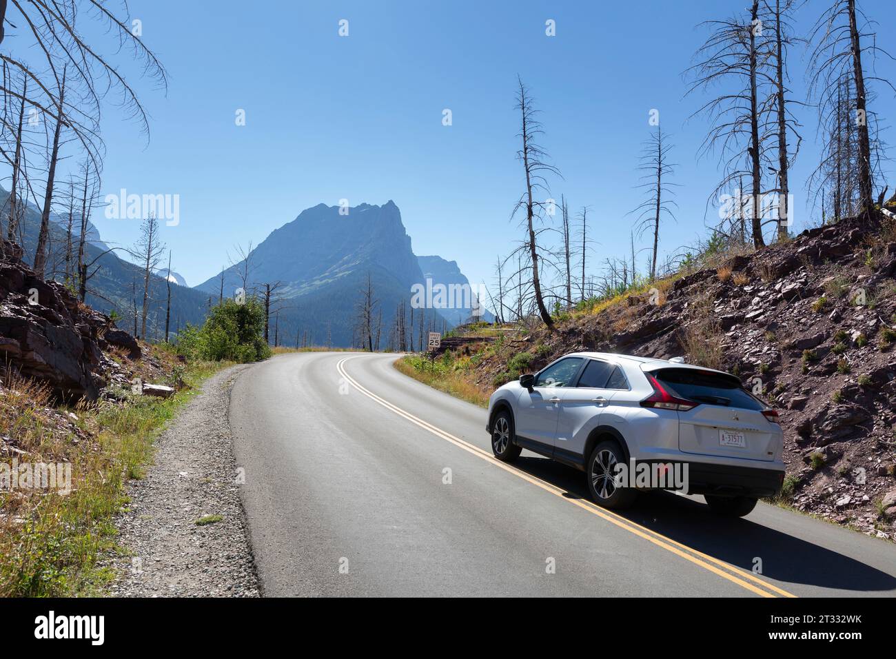 Visitors travel west along the Going-to-the-Sun Road near Saint Mary Falls in Glacier National Park, Montana. Stock Photo