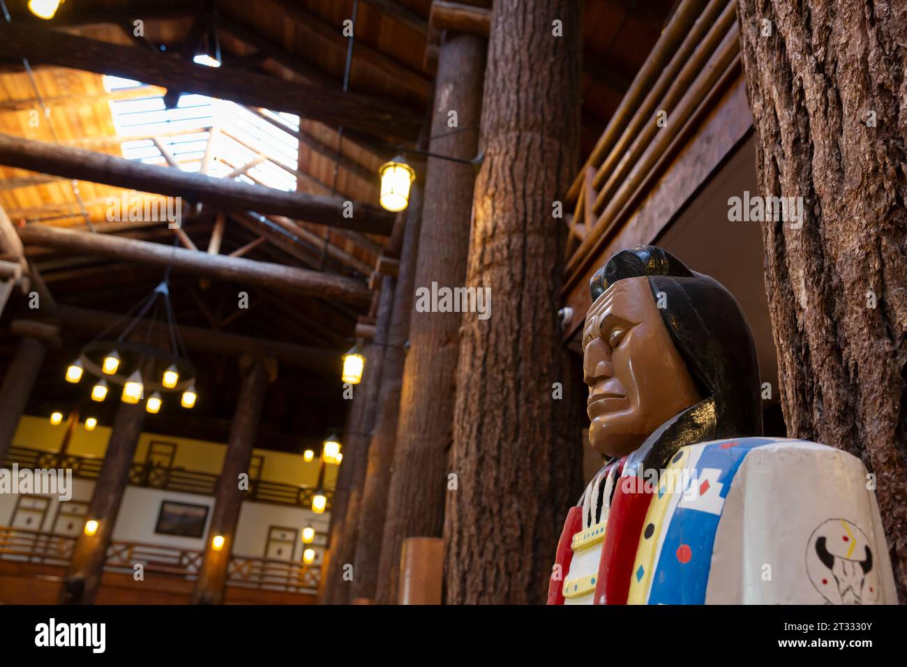 A traditional cigar store Indian greets visitors to Glacier Park Lodge in East Glacier Park, Montana. Stock Photo