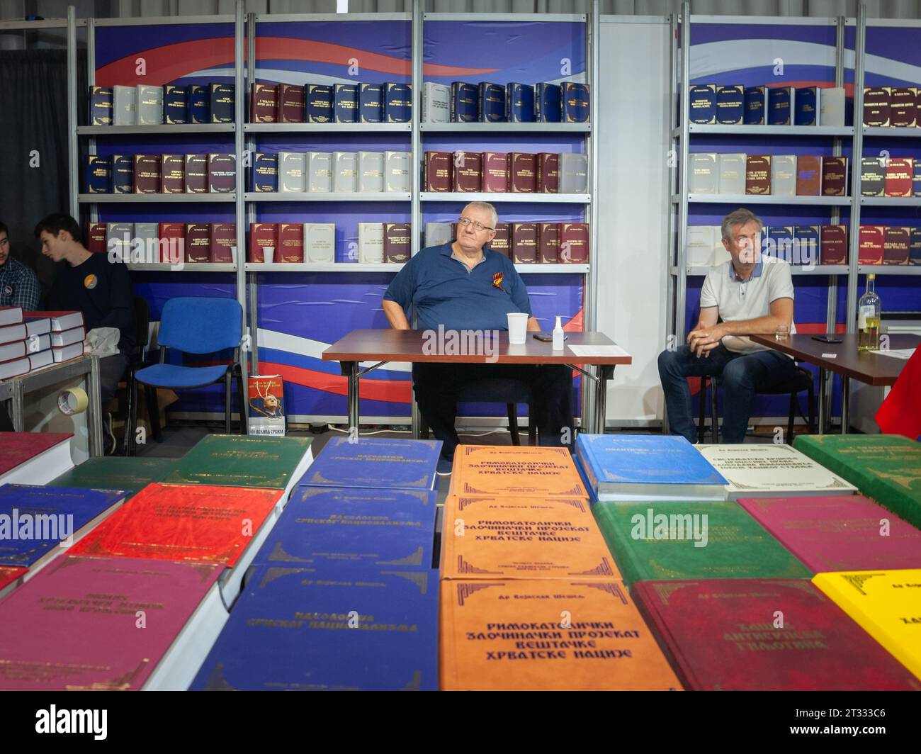 Picture of Vojislav Seselj standing in front of some of the books he ...