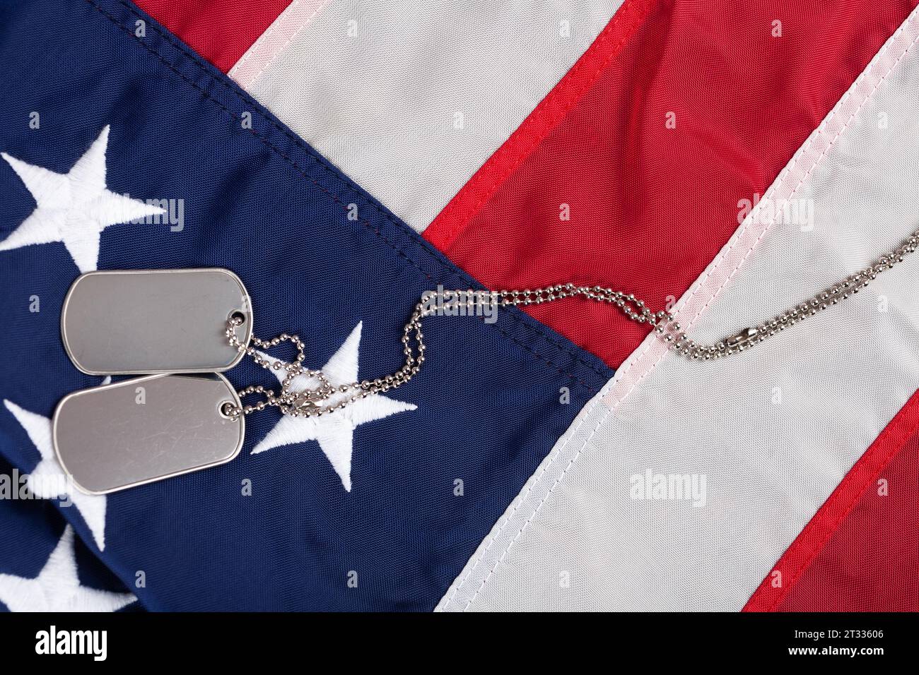 US army dog tags on USA national flag background Stock Photo - Alamy