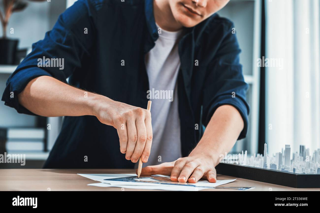 Architect or city planner draws city plan on blueprint, architecture