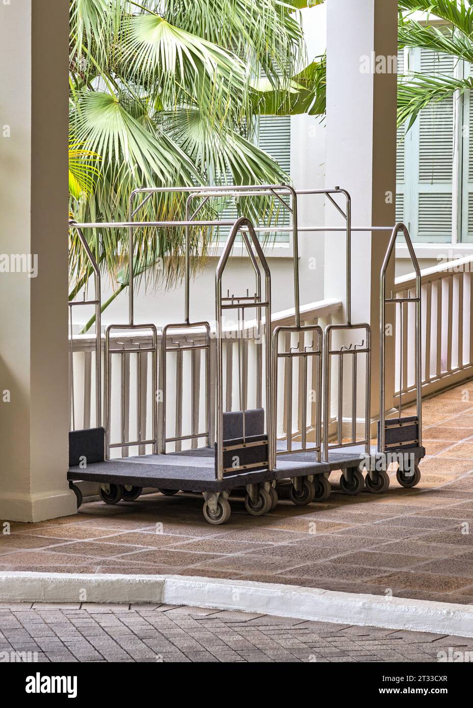Hotel luggage cart, luggage stroller in front of luxury hotel or
