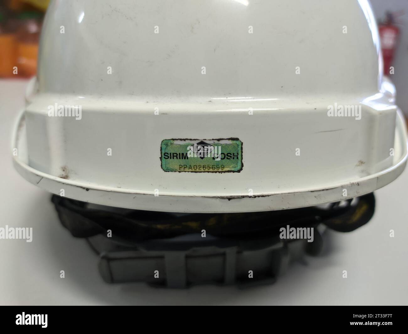 Malaysia, 14 April 2022: White safety helmet with SIRIM and DOSH stickers. Stock Photo